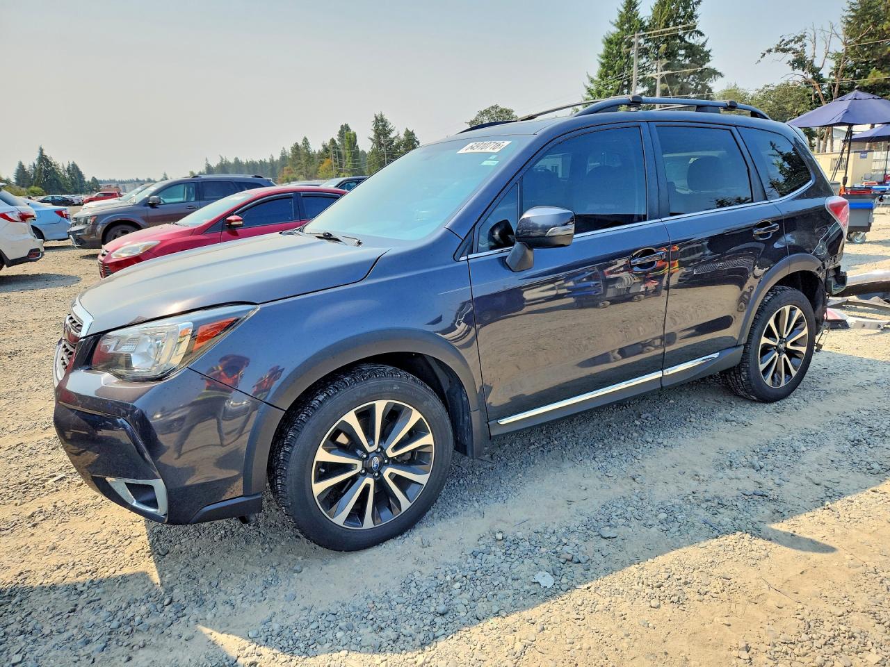 2017 Subaru Forester Touring, VIN JF2SJGWC0HH560566 — Rear end