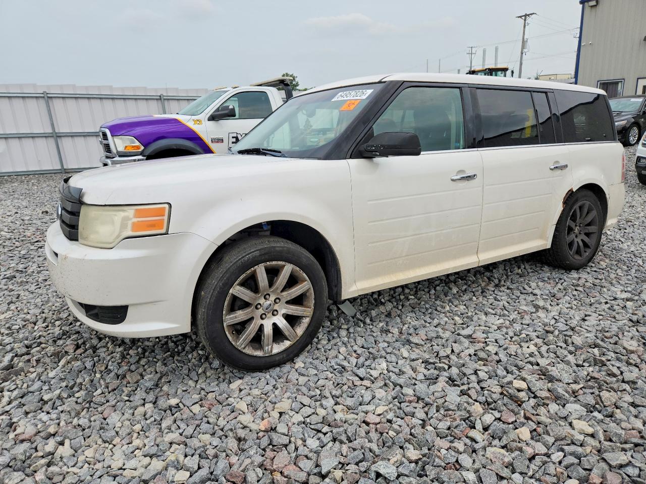 2009 Ford Flex Limited, VIN 2FMDK53C59BA09802 — Vandalism