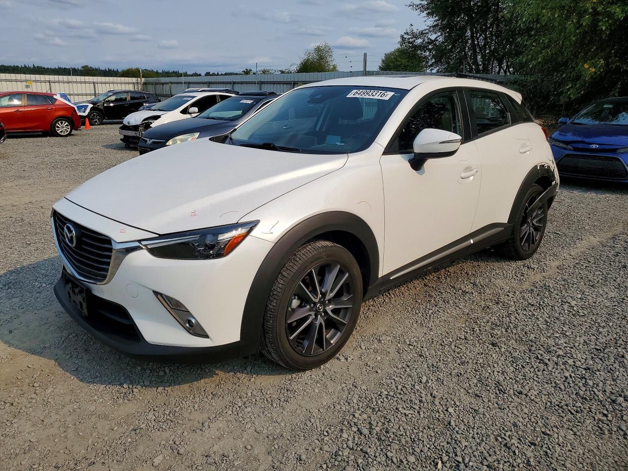 2018 Mazda CX-3 Grand Touring, VIN JM1DKFD79J0318688 — Rear end