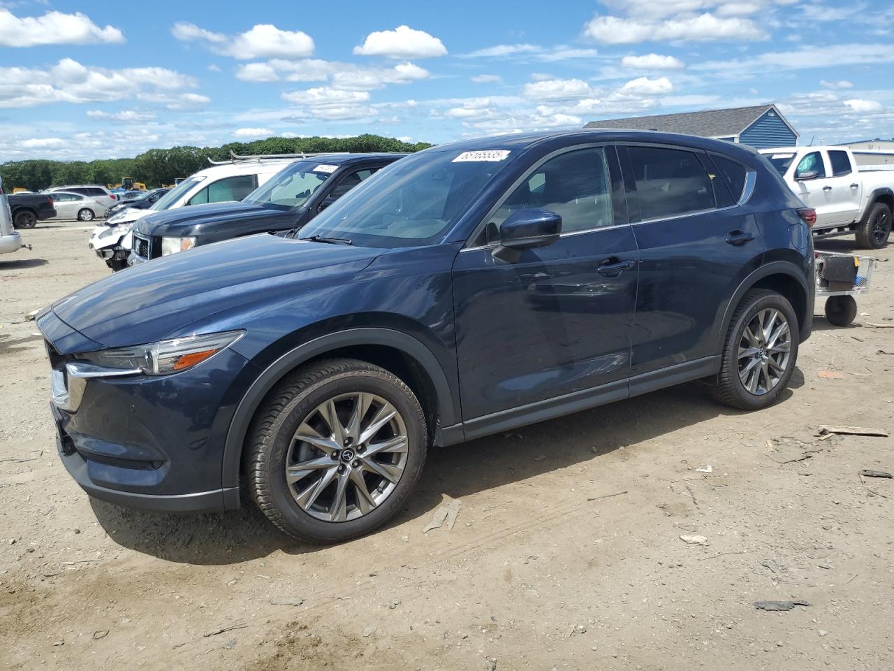 2021 Mazda CX-5 Signature, VIN JM3KFBEY8M0415632 — Front end