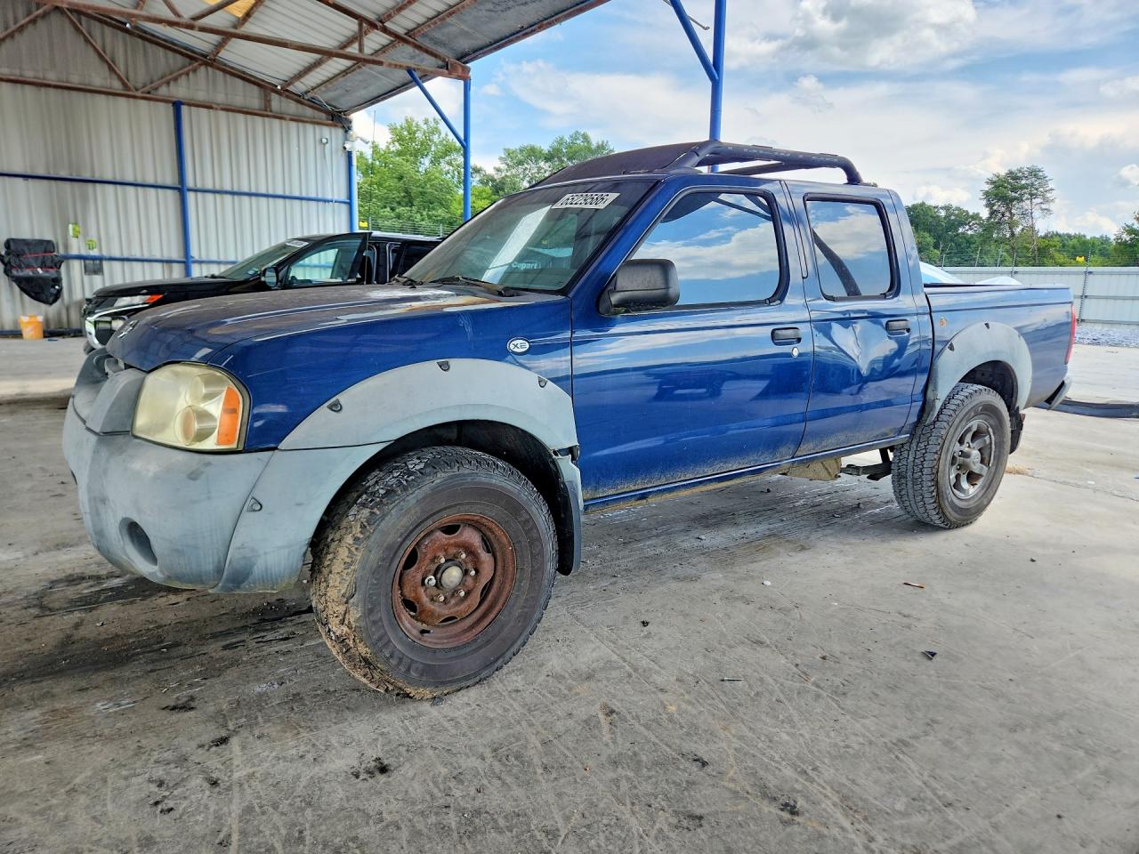 2001 Nissan Frontier XE, VIN 1N6ED27T01C373963 — Side