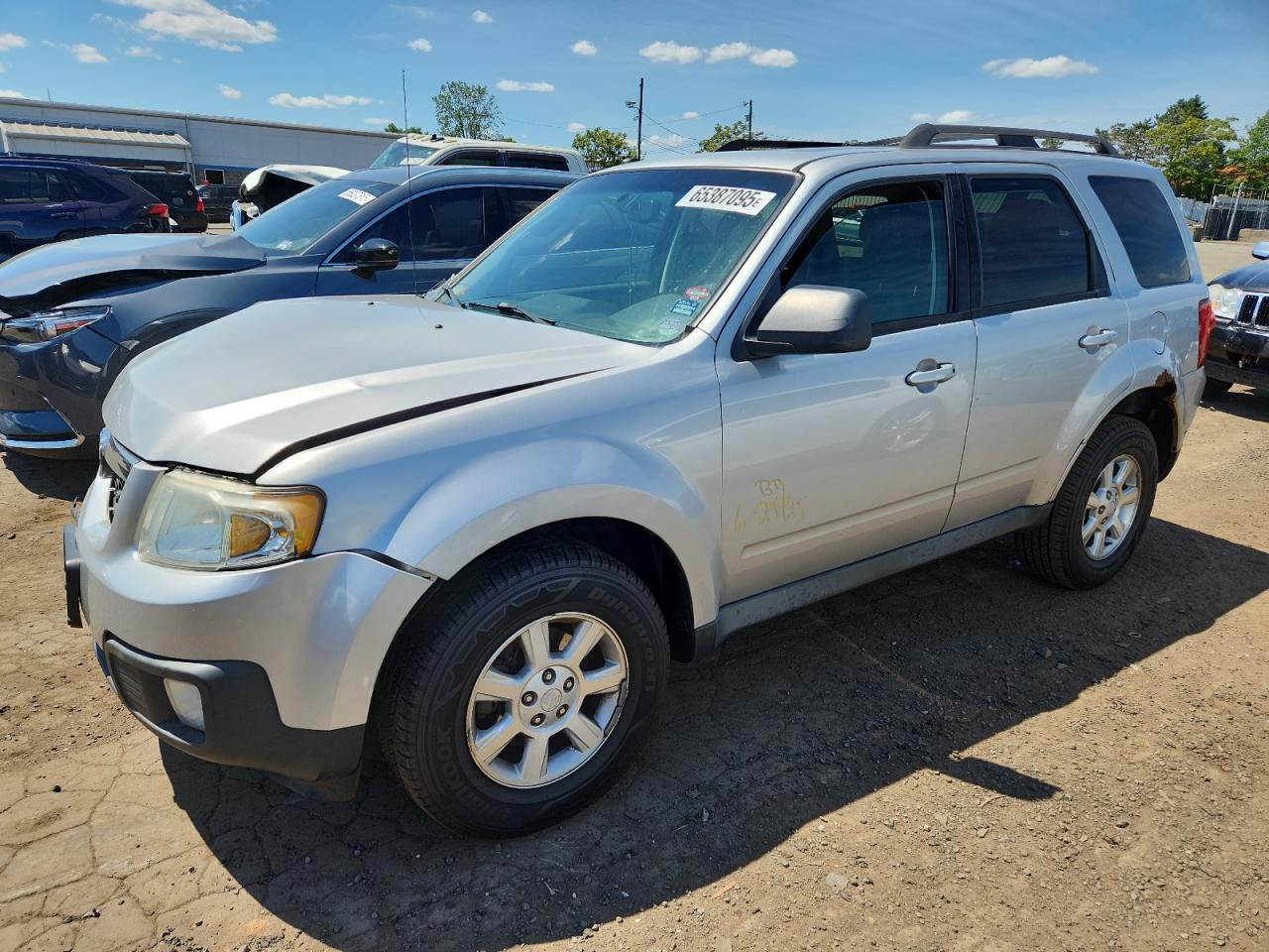 2010 Mazda Tribute Grand Touring, VIN 4F2CY9GG1AKM06145 — Front end