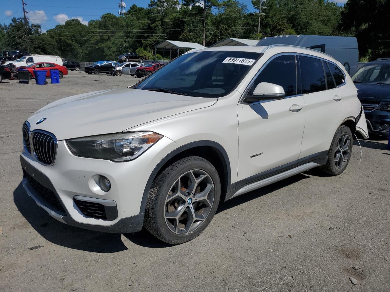 2018 BMW X1 xDrive28i, VIN WBXHT3C35J5F92376 — Water / flood