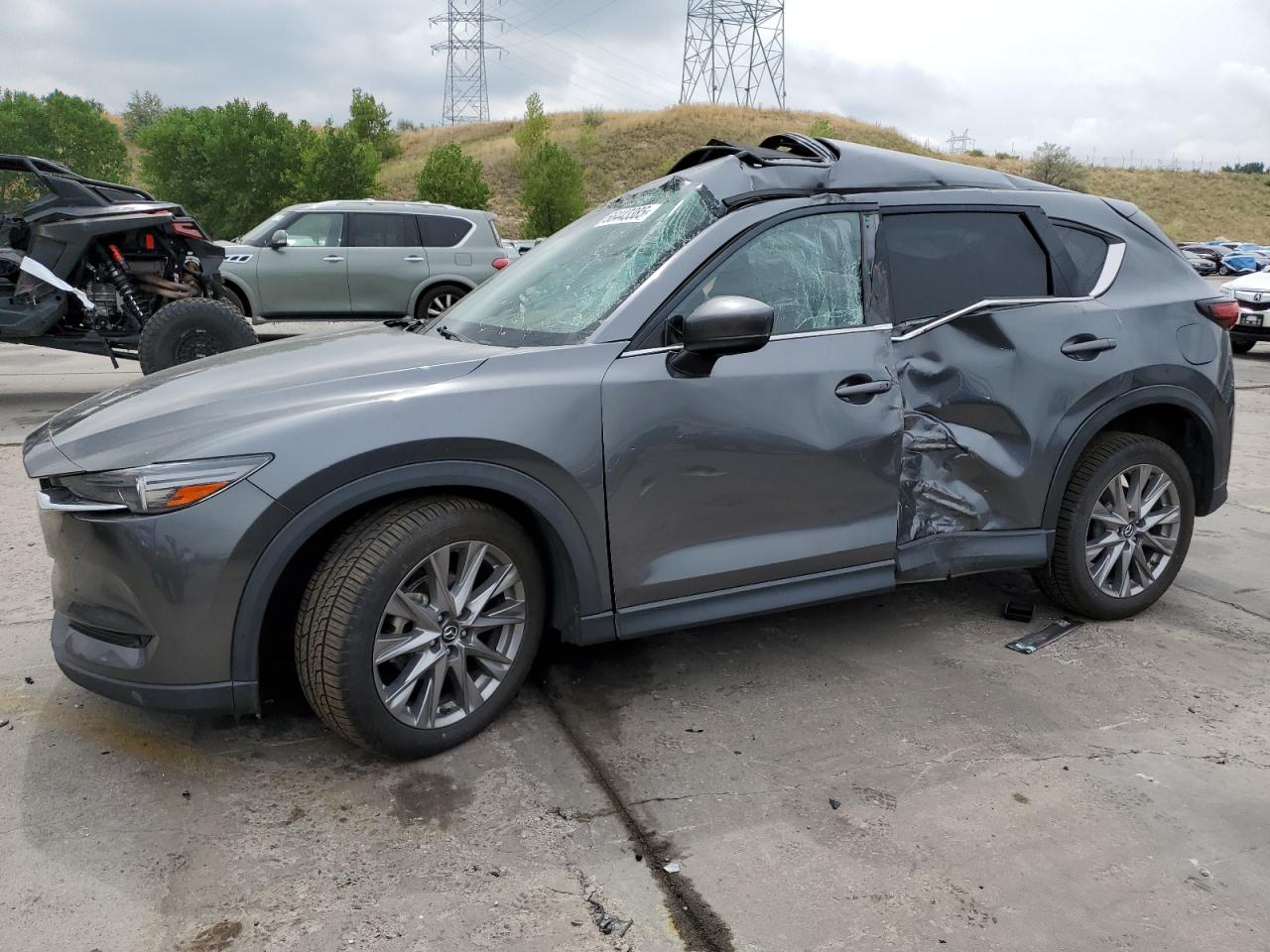2021 Mazda CX-5 Grand Touring, VIN JM3KFBDM4M0328986 — Side