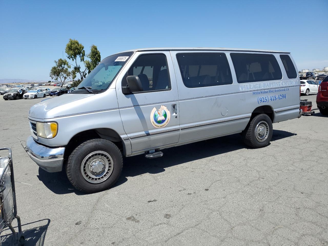 1994 Ford Econoline Wagon XL, VIN 1FBJS31H2RHB39585 — Minor dents and scratches