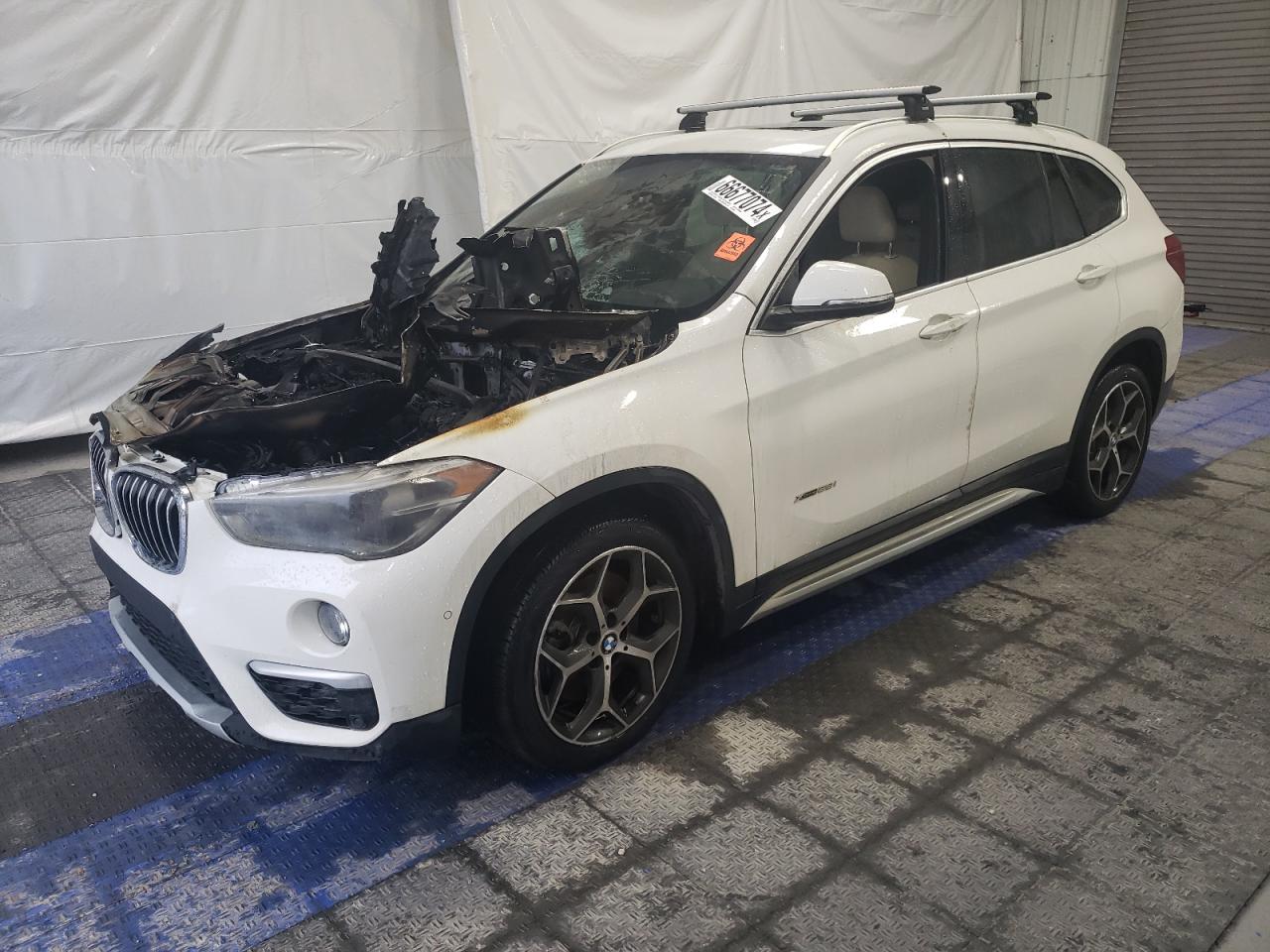 2018 BMW X1 xDrive28i, VIN WBXHT3C34J5K24851 — Engine fire