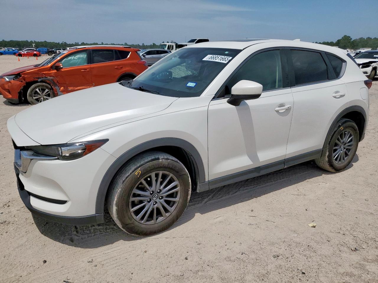 2021 Mazda CX-5 Touring, VIN JM3KFACM6M0386190 — Side