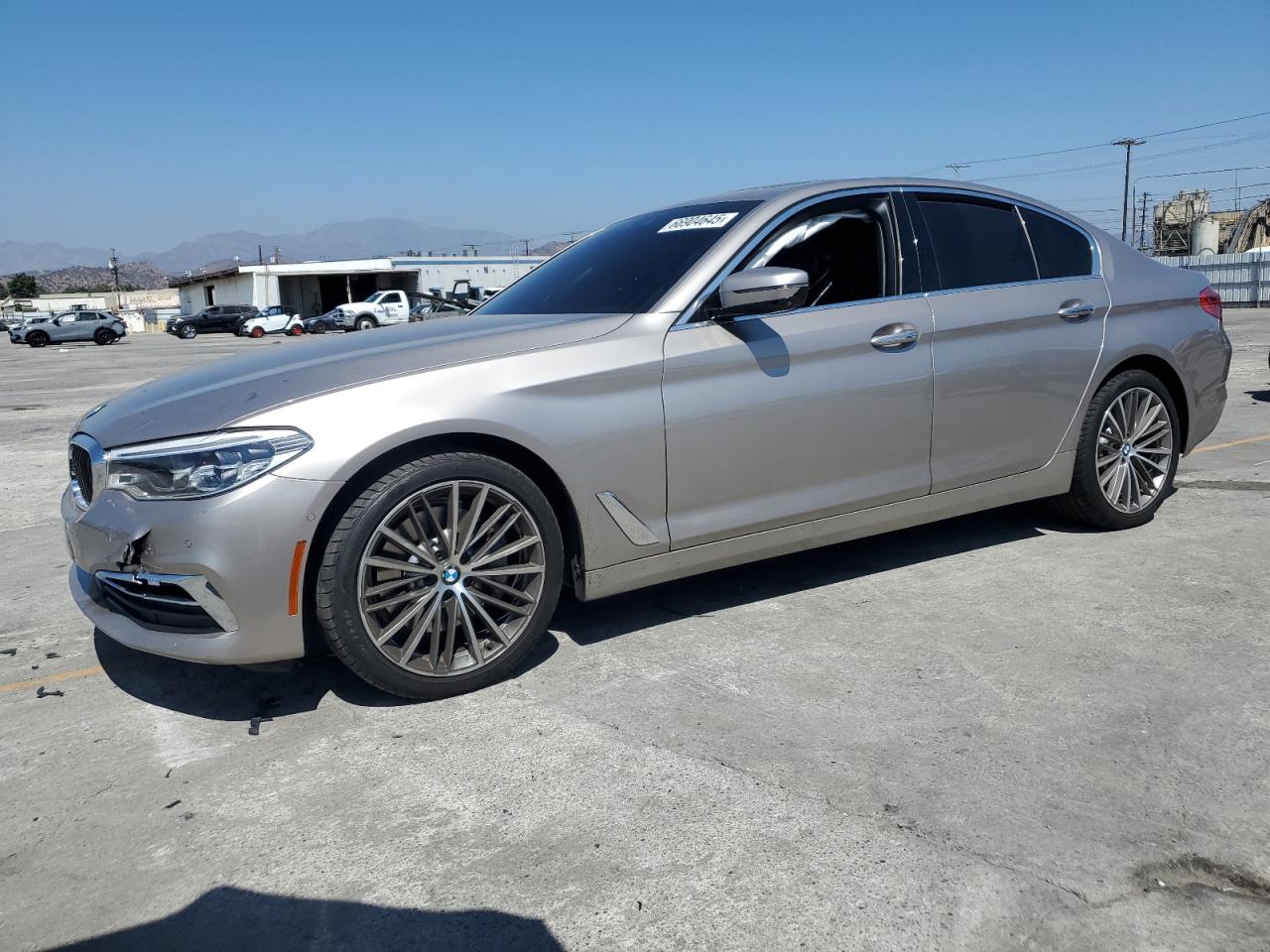 2018 BMW 5 Series 530i, VIN WBAJA5C54JWA38447 — Side