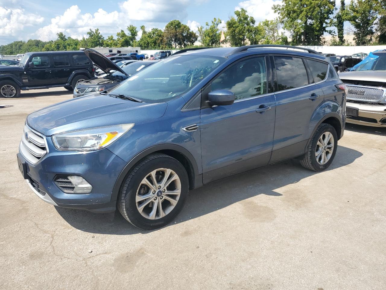 2018 Ford Escape SE, VIN 1FMCU0GD7JUC03418 — Side