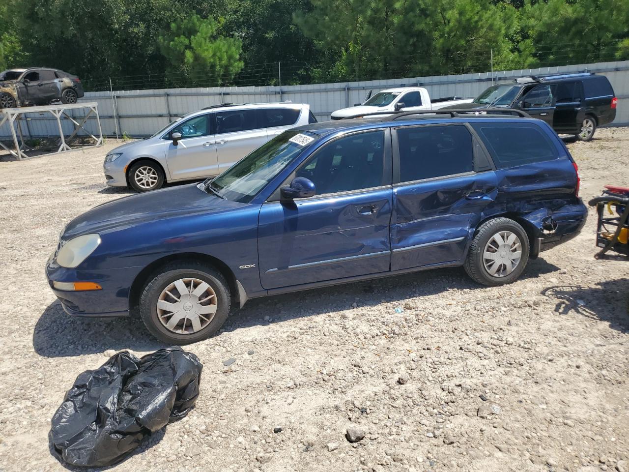 2002 Daewoo Nubira CDX, VIN KLAJB82Z12K770943 — Бок