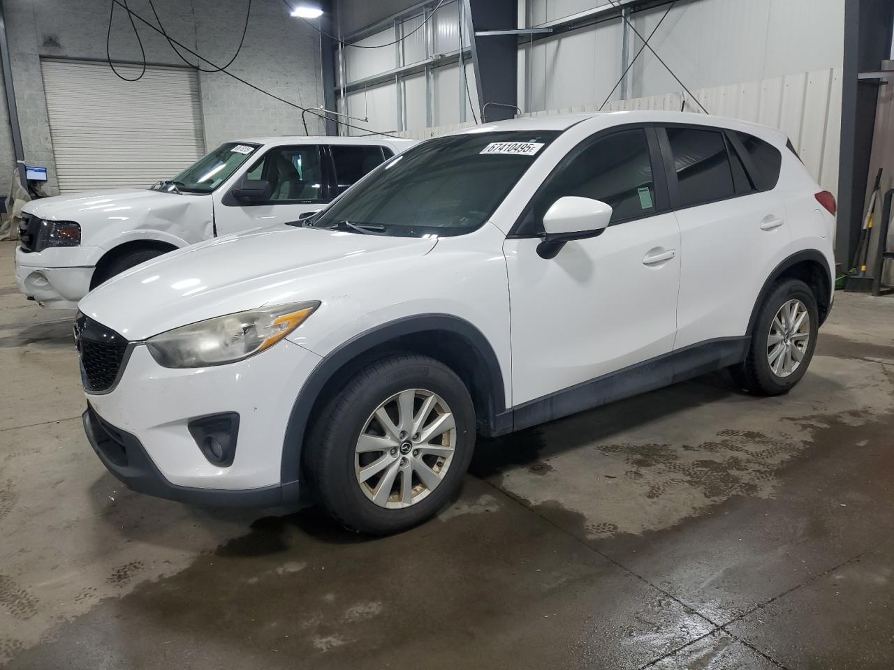 2013 Mazda CX-5 Touring, VIN JM3KE2CE1D0117581 — Interior fire