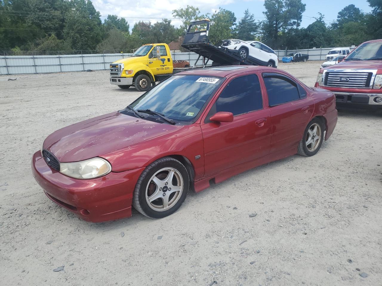 1999 Ford Contour, VIN 1FAFP68G1XK163562 — Side