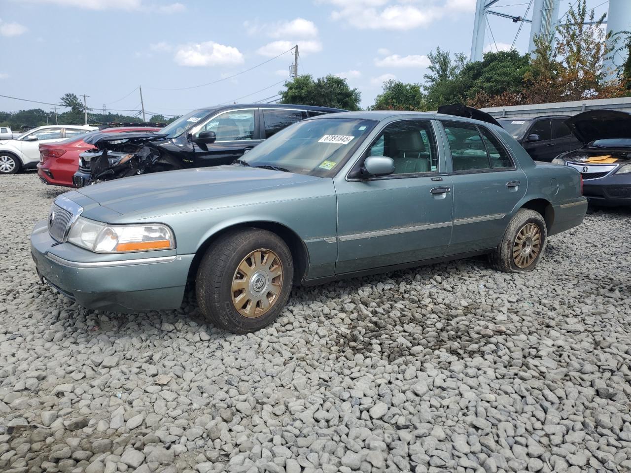 2005 Mercury Grand Marquis LS Premium, VIN 2MEFM75W35X665244 — Фото с аукциона 1 of 4