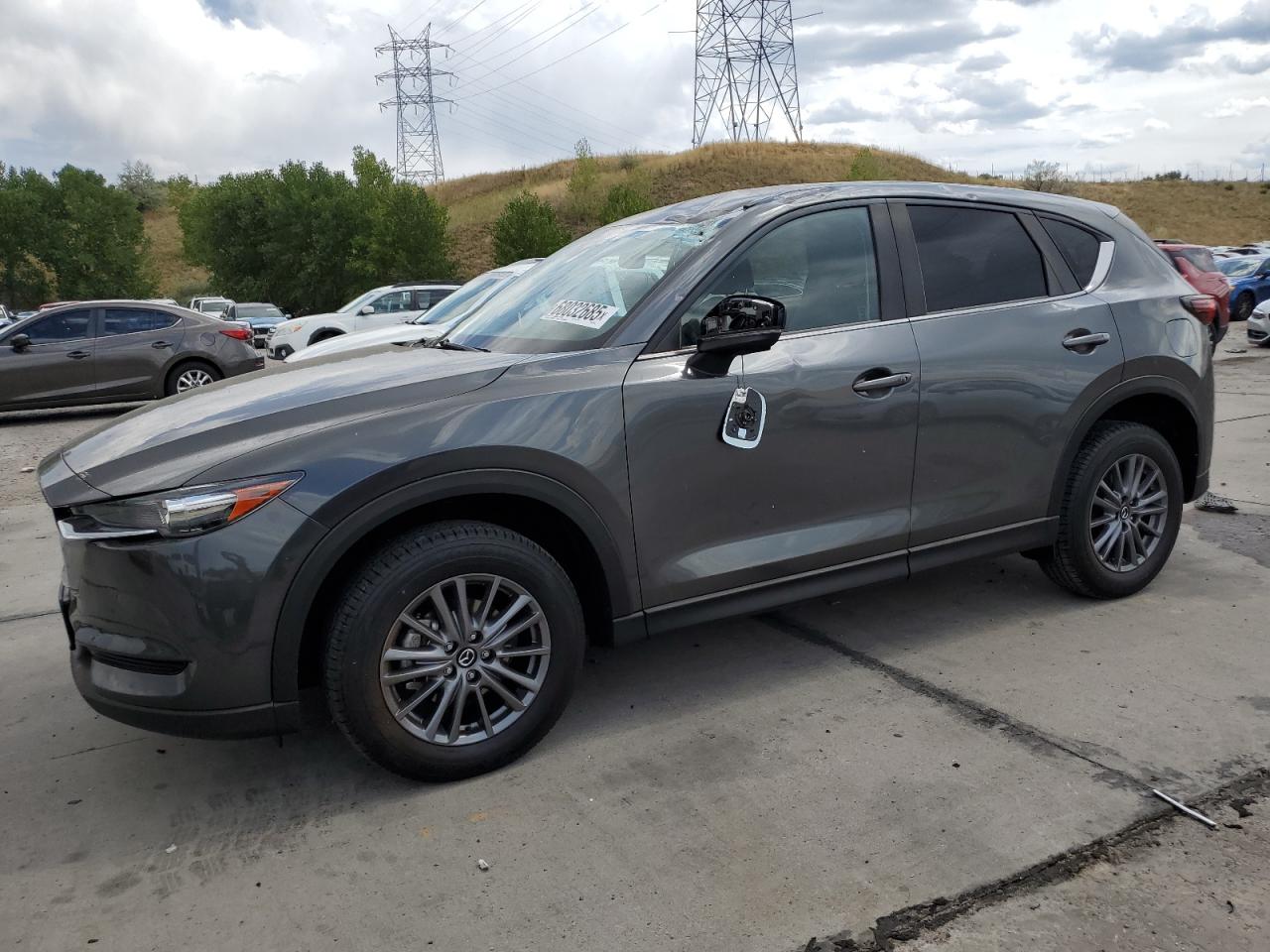 2021 Mazda CX-5 Touring, VIN JM3KFBCM3M0462292 — Water / flood
