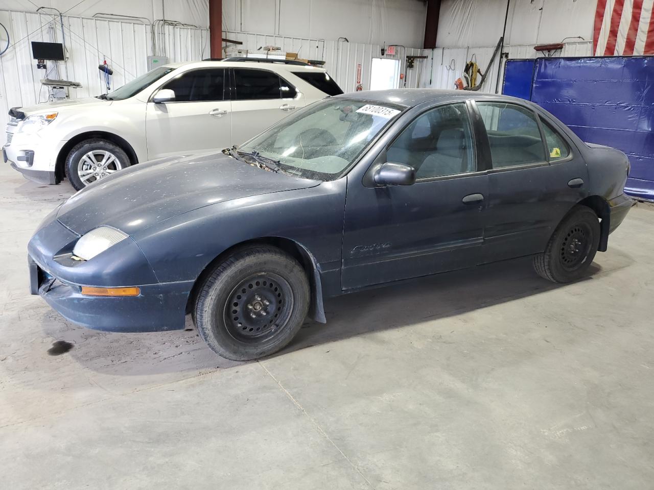 1997 Pontiac Sunfire SE, VIN 1G2JB5240V7547591 — Град