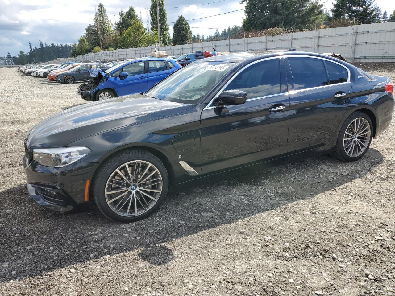2018 BMW 5 Series 530e, VIN WBAJA9C53JB252809 — Side