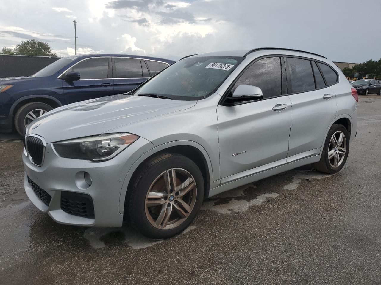 2018 BMW X1 sDrive28i, VIN WBXHU7C33J5H41694 — Side