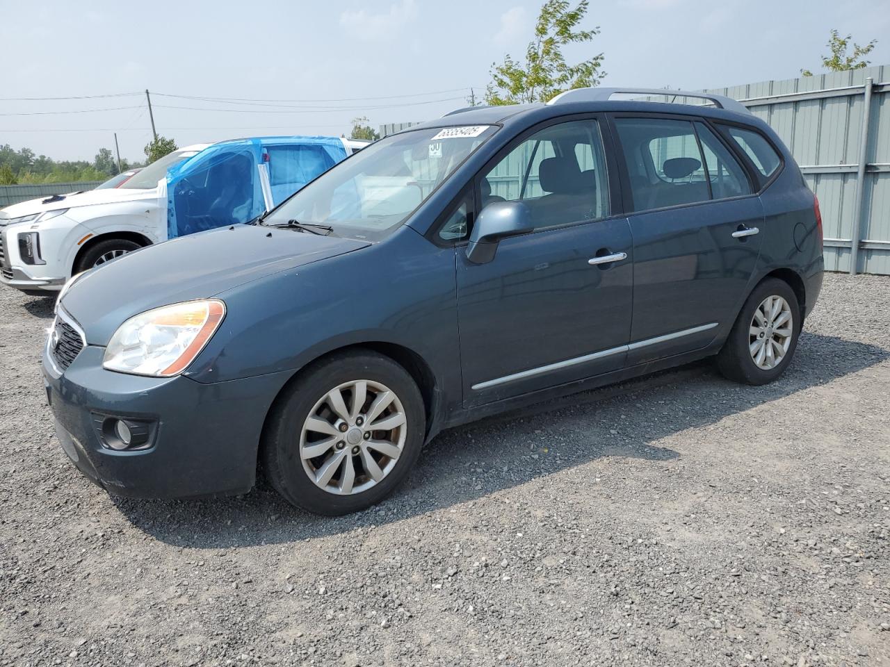 2012 Kia Rondo, VIN KNAHH8A69C7408907 — Side