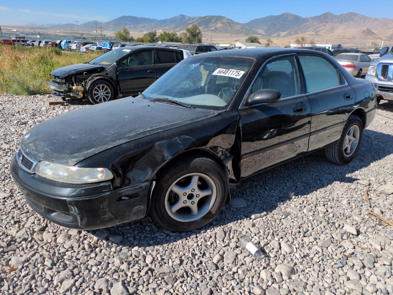 1994 Mazda 626 DX, VIN 1YVGE22C4R5211280 — Undercarriage