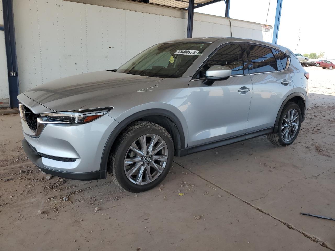 2021 Mazda CX-5 Grand Touring, VIN JM3KFBDM0M1348260 — Side