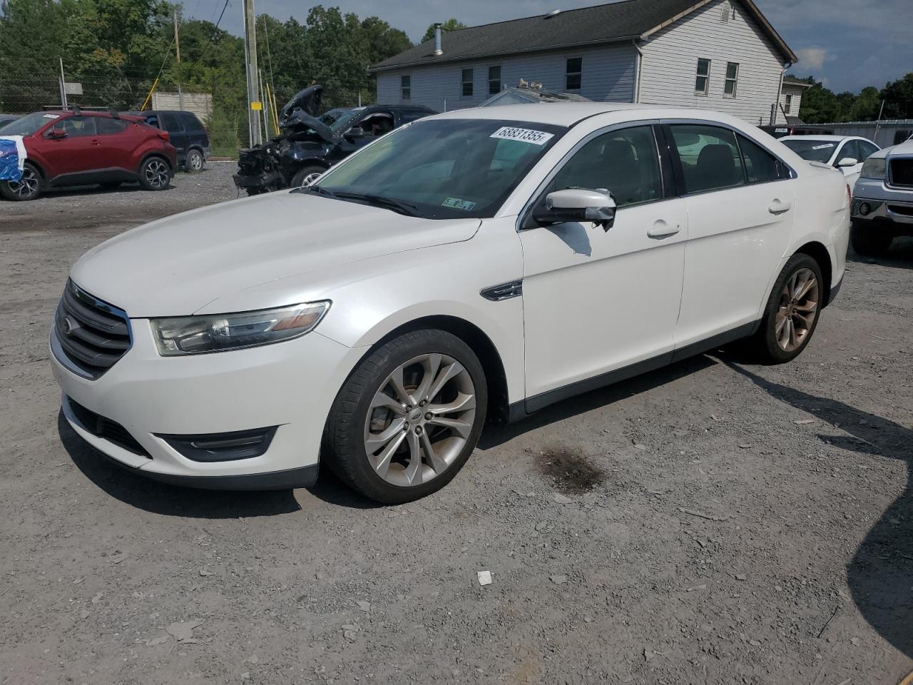 2013 Ford Taurus SEL, VIN 1FAHP2E89DG183328 — Side