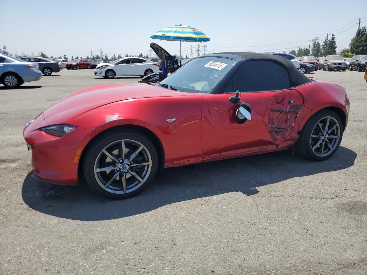 2016 Mazda MX-5 Miata Grand Touring, VIN JM1NDAD73G0105679 — Side