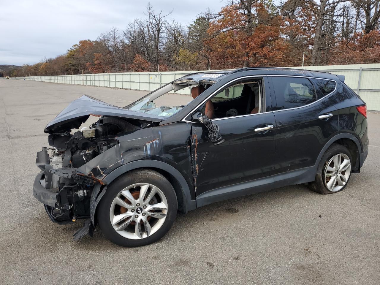 2015 Hyundai Santa Fe, VIN 5XYZWDLA8FG243897 — Rollover
