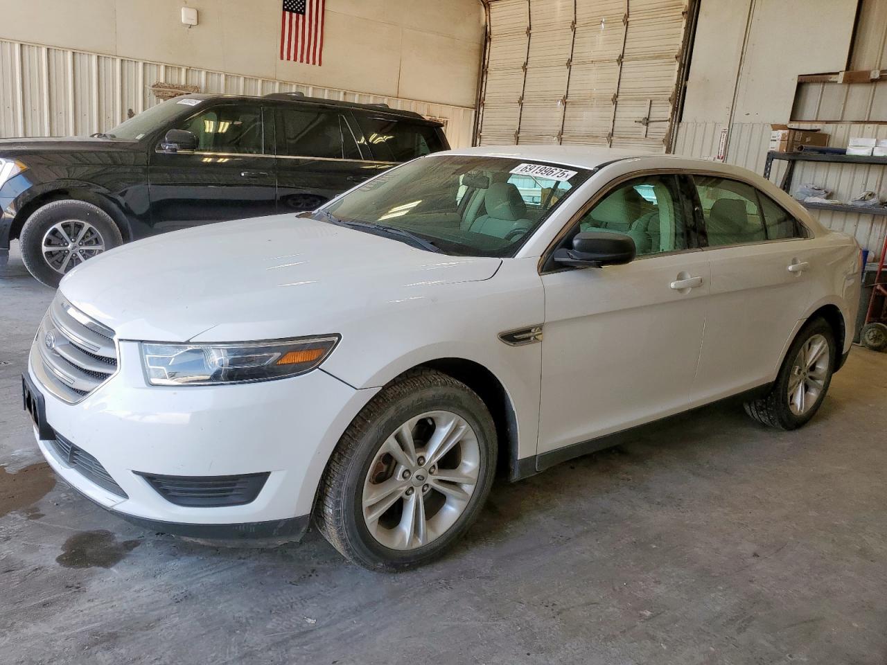 2016 Ford Taurus SE, VIN 1FAHP2D85GG136304 — Side