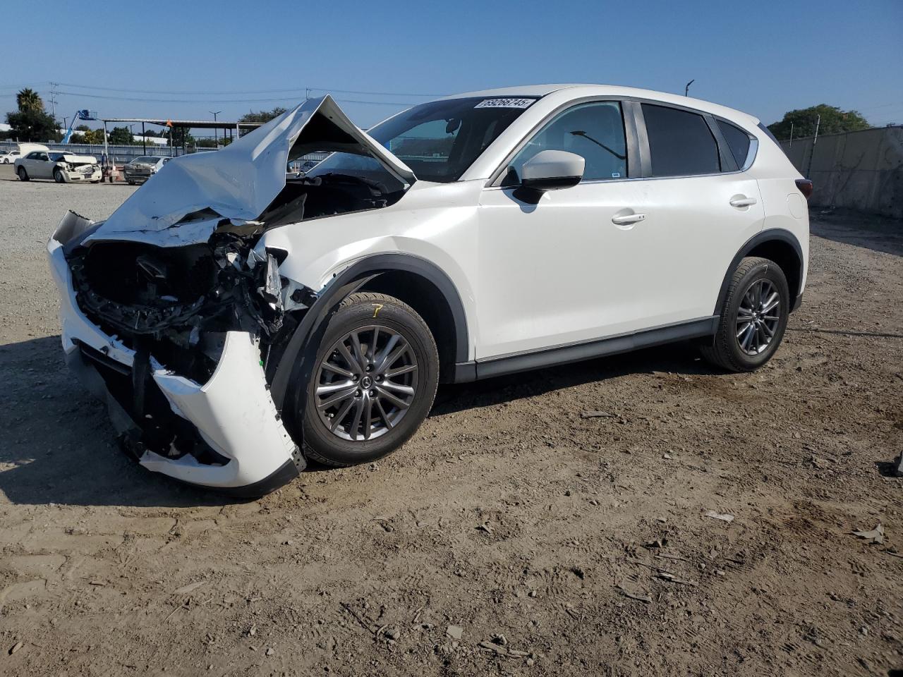 2021 Mazda CX-5 Touring, VIN JM3KFACM7M0332557 — Front end