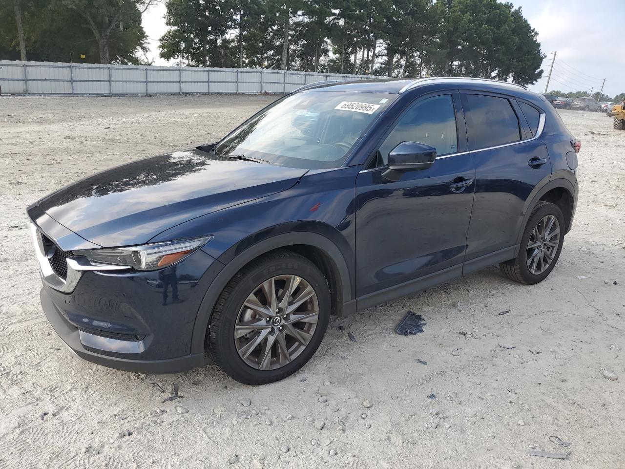 2021 Mazda CX-5 Signature, VIN JM3KFBEY4M0444870 — Side