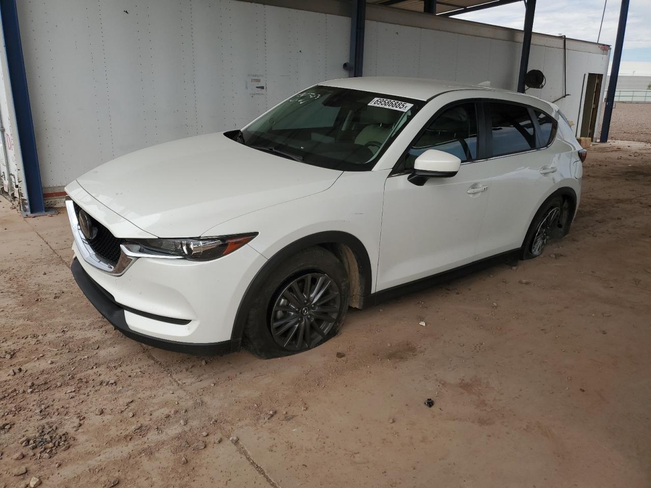 2021 Mazda CX-5 Touring, VIN JM3KFBCM2M0444723 — Side