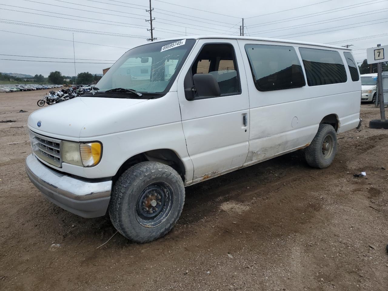 1996 Ford Econoline Wagon XL, VIN 1FBJS31H0THA03639 — Side