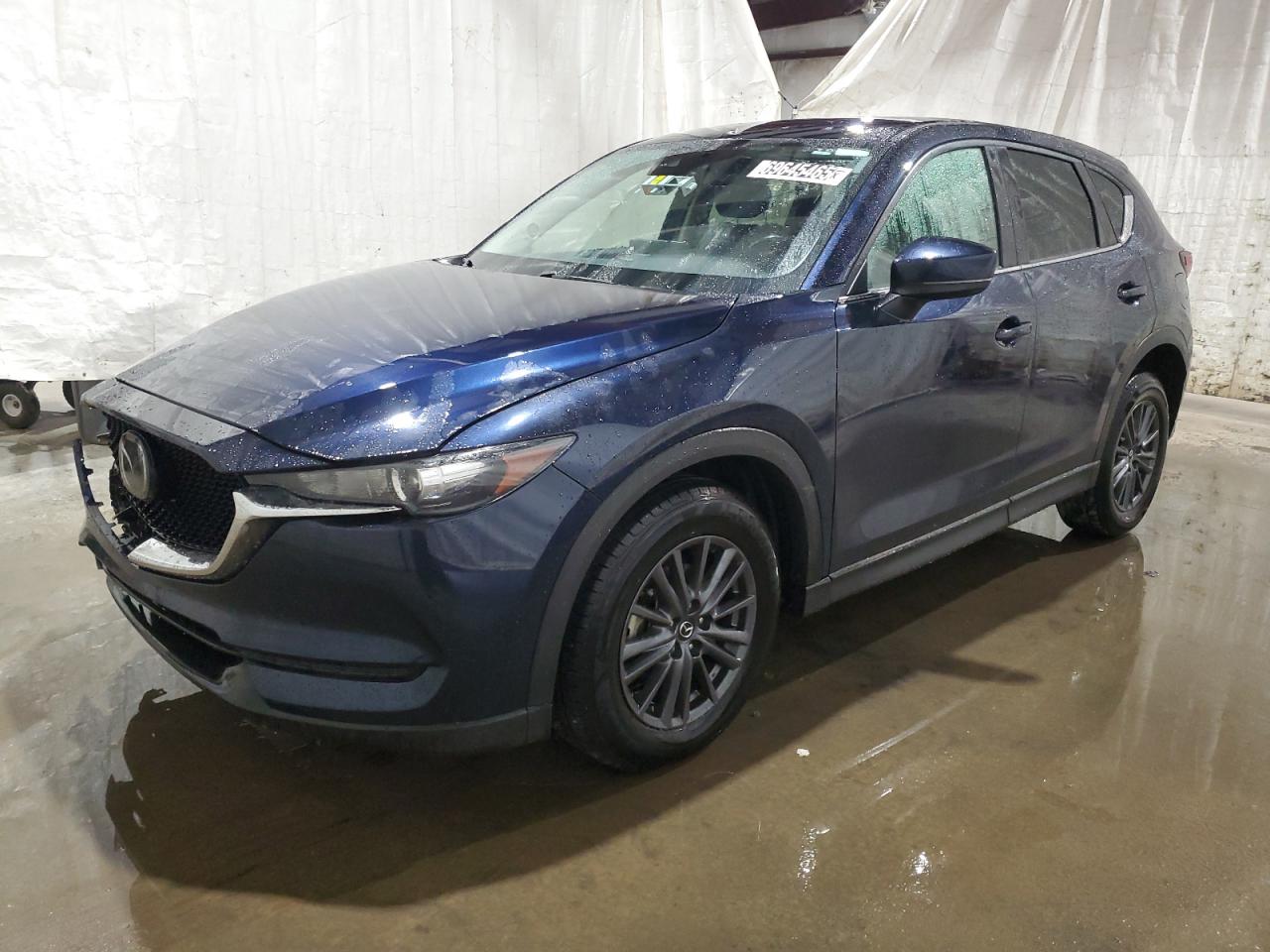 2021 Mazda CX-5 Touring, VIN JM3KFACM2M1324912 — Front end