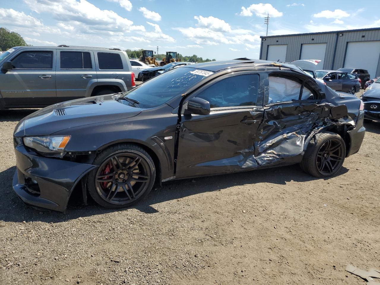 2014 Mitsubishi Lancer Evolution MR, VIN JA32W5FV7EU014290 — Side