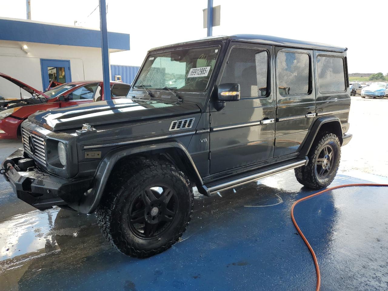 2004 Mercedes-Benz G 500, VIN WDCYR49EX4X150557 — Minor dents and scratches