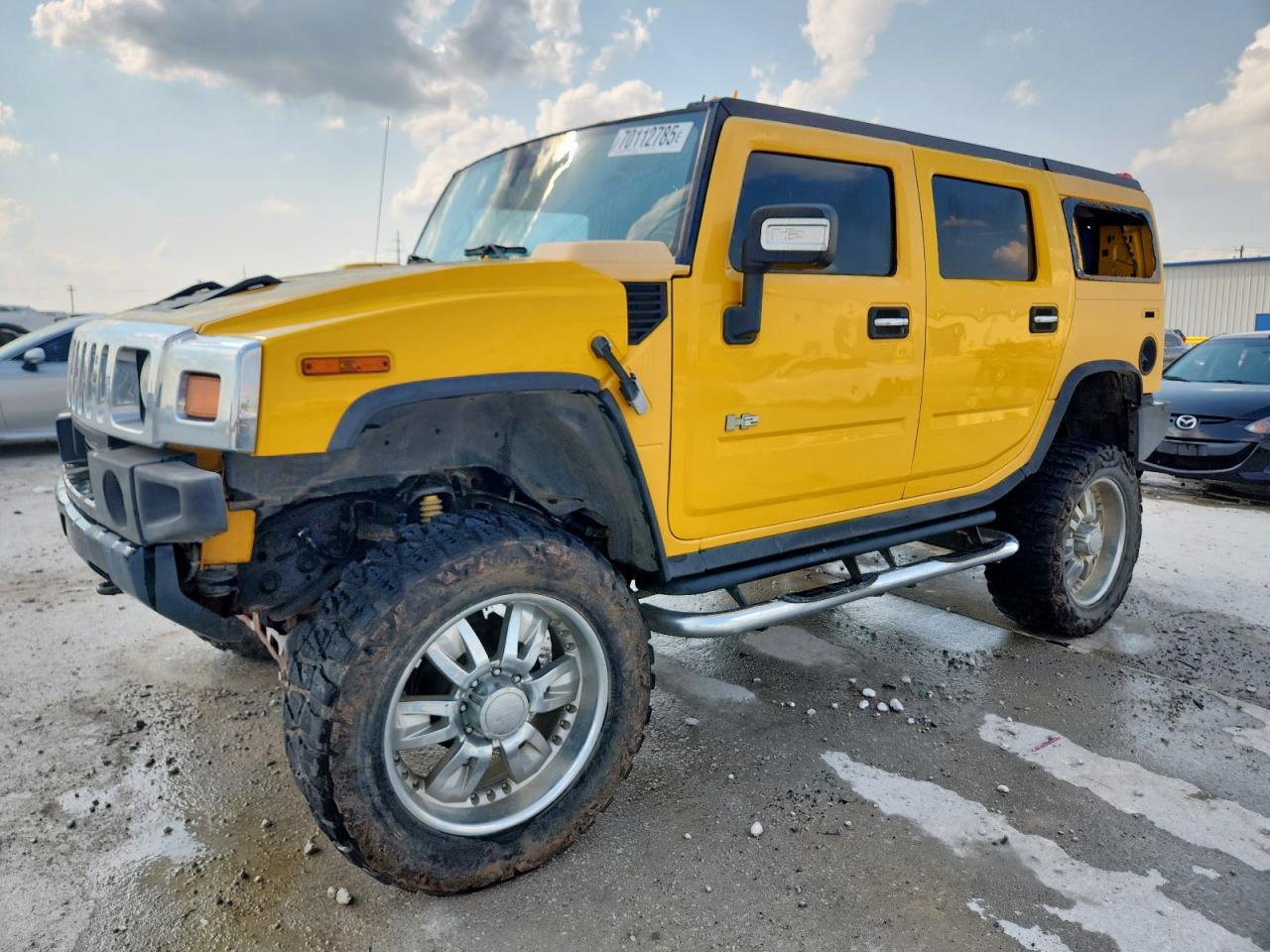 2005 Hummer H2 SUV, VIN 5GRGN23U35H121932 — Hail