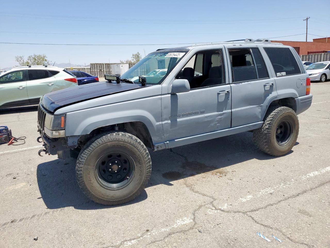 1997 Jeep Grand Cherokee Limited, VIN 1J4GZ78Y2VC746716 — Side