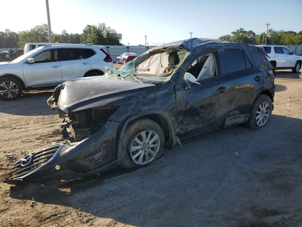 2016 Mazda CX-5 Touring, VIN JM3KE2CY6G0805686 — Rollover