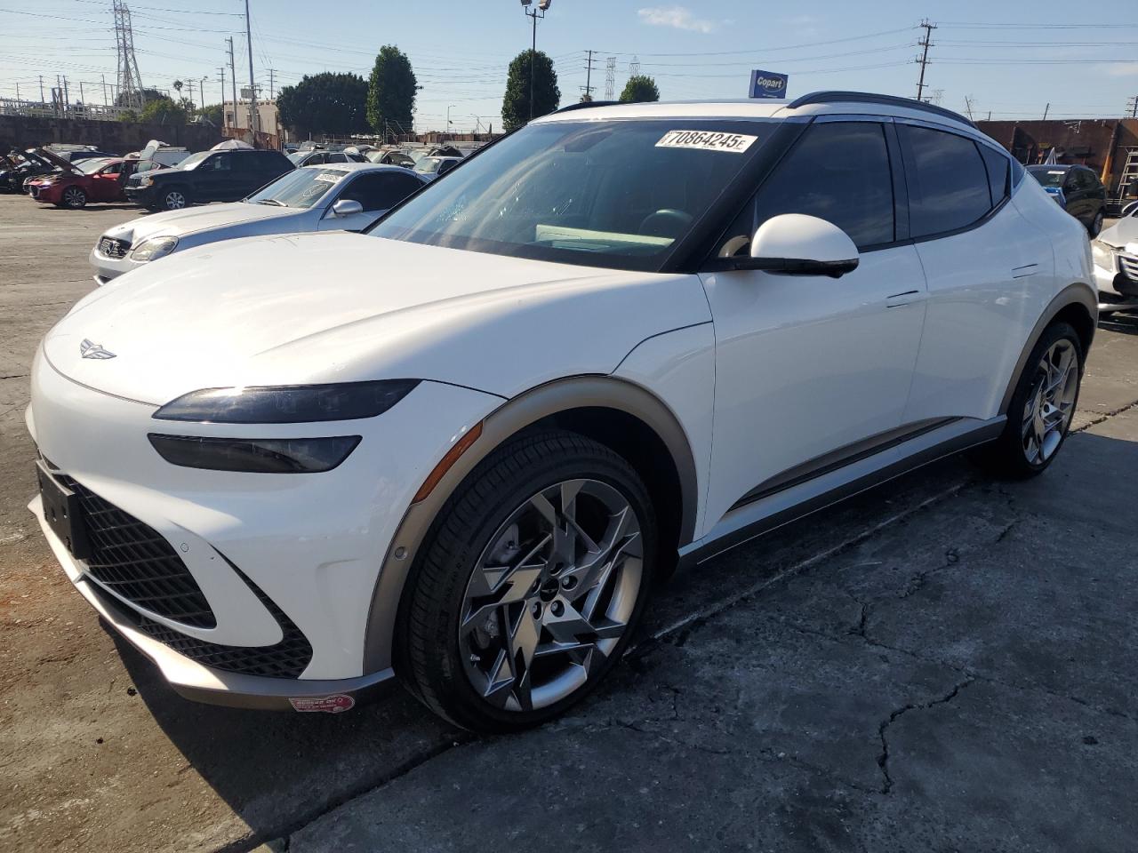 2023 Genesis GV60 Performance, VIN KMUKEDTBXPU017175 — Side