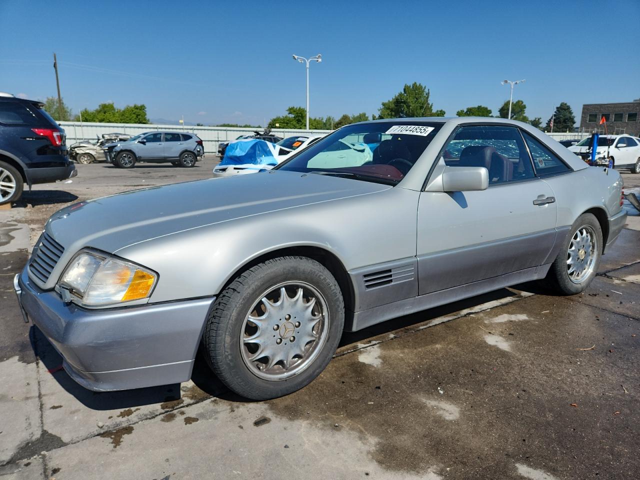1990 Mercedes-Benz 500, VIN WDBFA66E6LF002493 — Hail