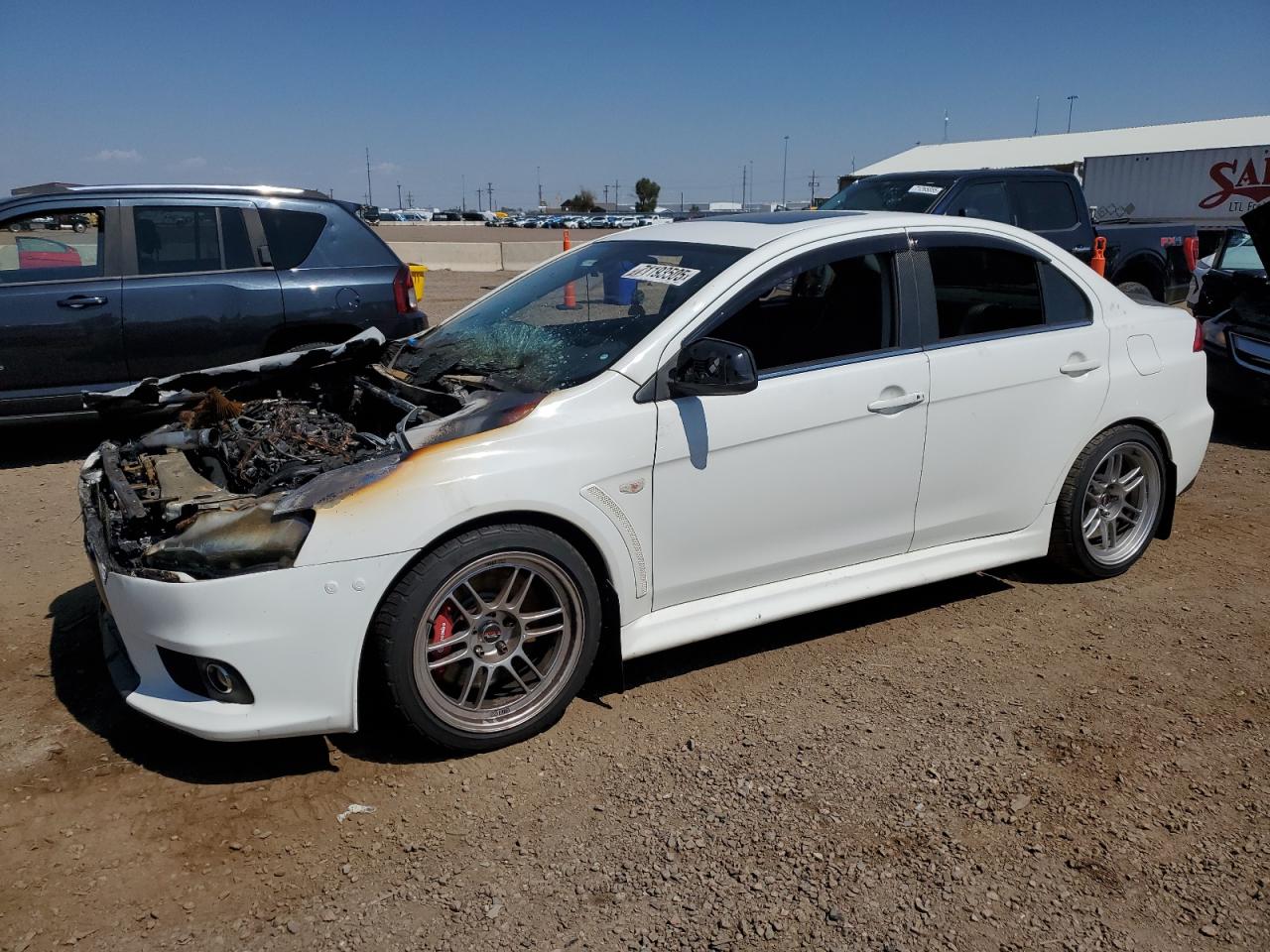2014 Mitsubishi Lancer Evolution MR, VIN JA32W5FV2EU005416 — Engine fire