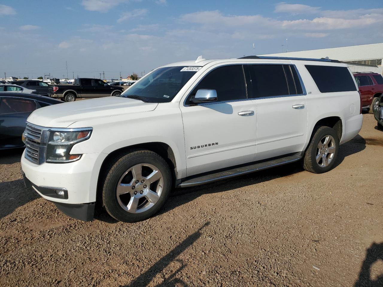 2015 Chevrolet Suburban LTZ, VIN 1GNSKKKC9FR519338 — Hail