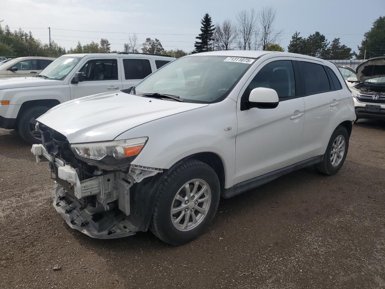 2011 Mitsubishi Outlander Sport ES, VIN JA4AH3AU4BZ601615 — Rear end