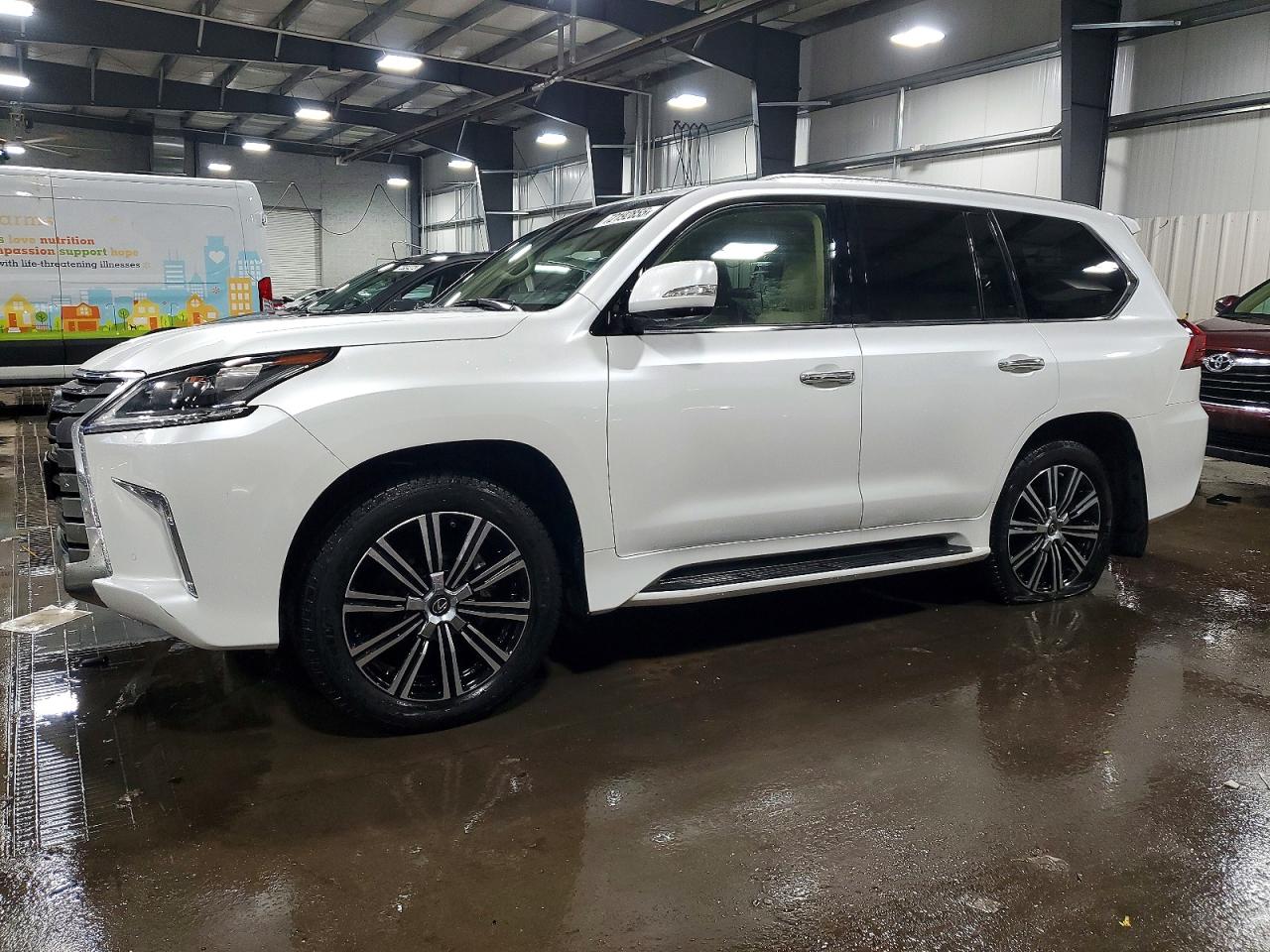 2020 Lexus LX 570, VIN JTJDY7AX9L4325299 — Бок
