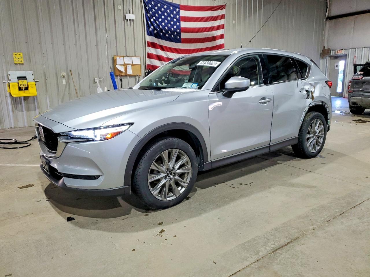2021 Mazda CX-5 Grand Touring, VIN JM3KFBDM7M1480304 — Side