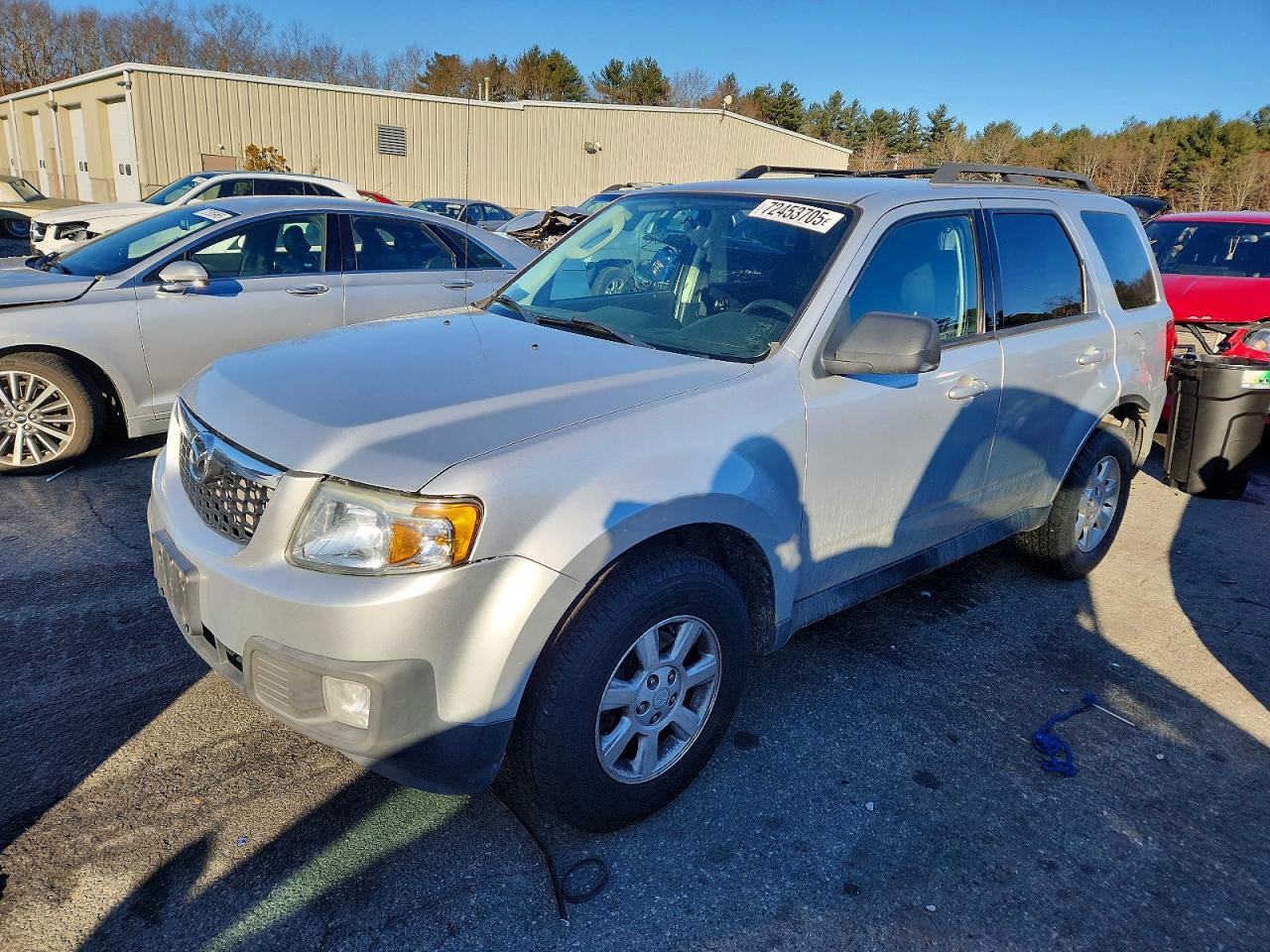 2011 Mazda Tribute Touring, VIN 4F2CY9C72BKM00734 — Бок