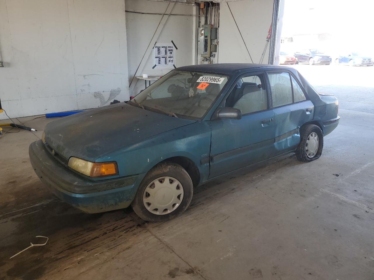1994 Mazda Protege DX, VIN JM1BG2248R0778768 — Бок