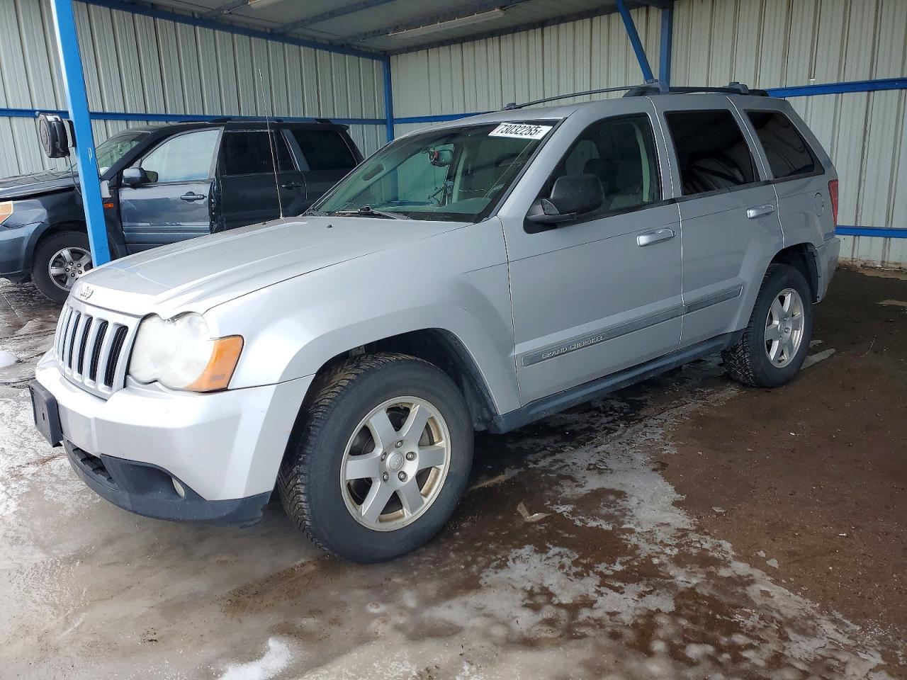 2010 Jeep Grand Cherokee Laredo, VIN 1J4PR4GK1AC127417 — Undercarriage
