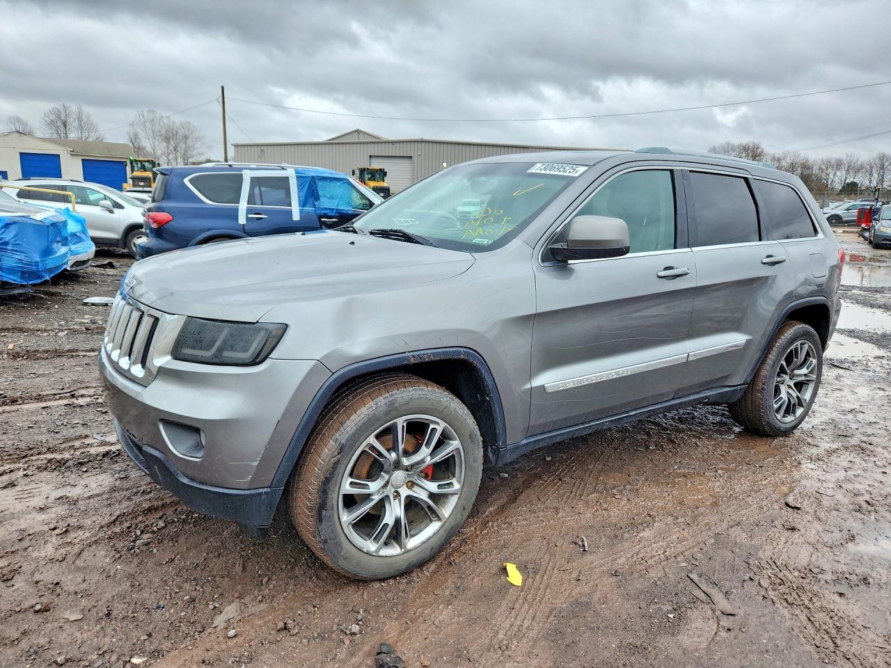 2011 Jeep Grand Cherokee Laredo, VIN 1J4RR4GG9BC715166 — Minor dents and scratches