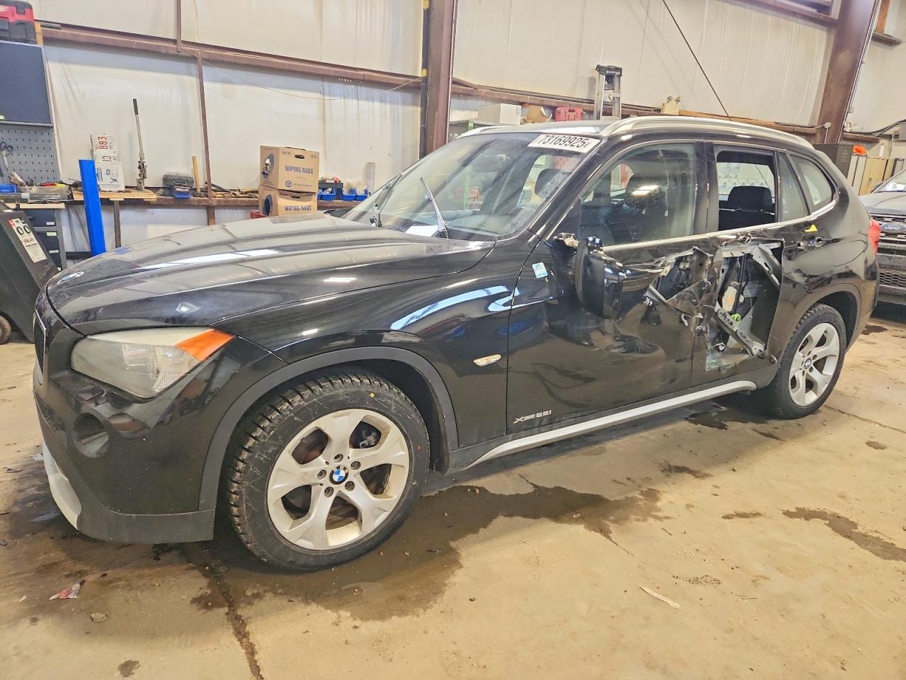 2012 BMW X1 28i, VIN WBAVL1C5XCVR80836 — Side